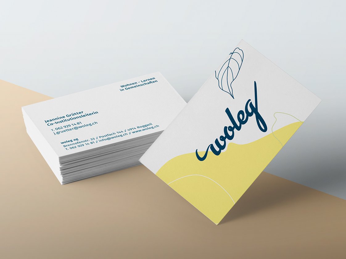 Gestaltete woleg-Visitenkarten und Briefschaft mit Logo und grafischen Flächen.