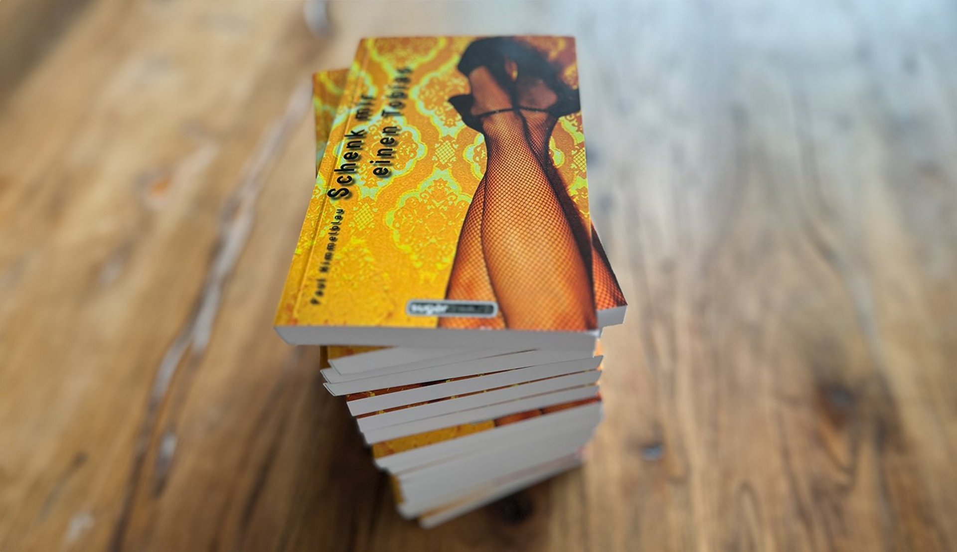 Bücher auf Holztisch, Cover «Schenk mir einen Tobias» 