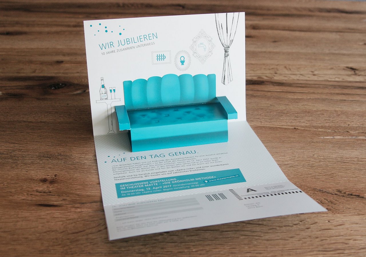 Jubiläumskarte Pop-up 10 Jahre Böhlen AG mit Bühnenmotiv und gestaltetem Markenauftritt