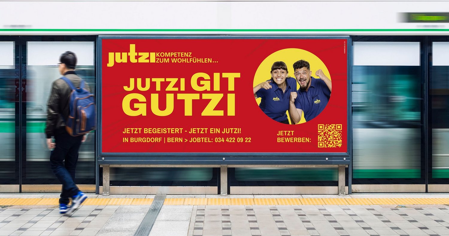 F12-Plakatkampagne der Daniel Jutzi AG mit Claim «Jutzi git Gutzi» und Hinweis zum Bewerben per QR-Code.